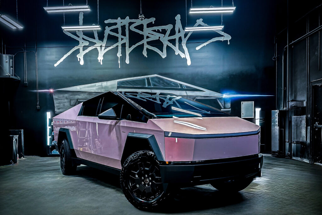 Pink-wrapped Cybertruck under a Tinterz drip tag