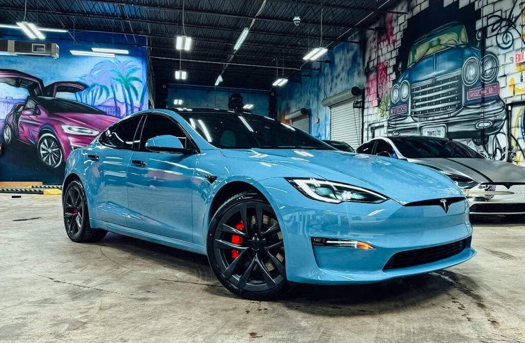 Blue Tesla Model S in the Tinterz bay
